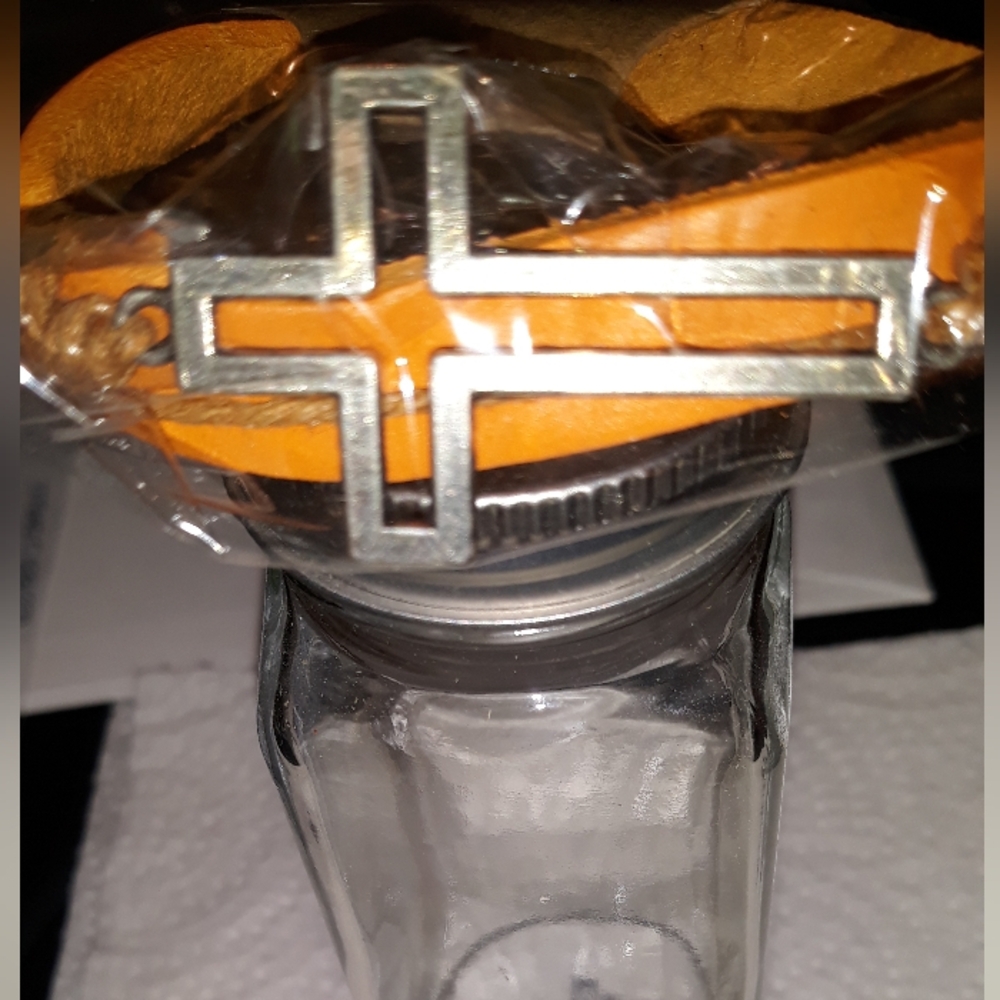Cross Bracelet Leather with metal Cross attachment on top. New in package.NWT